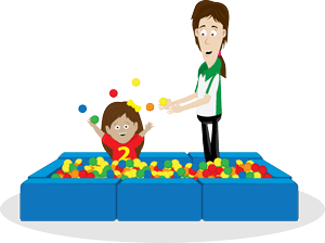 Child and therapist playing in a ball pit