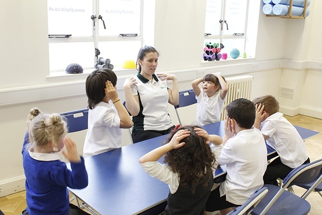 Children playing Simon Says with Therapist
